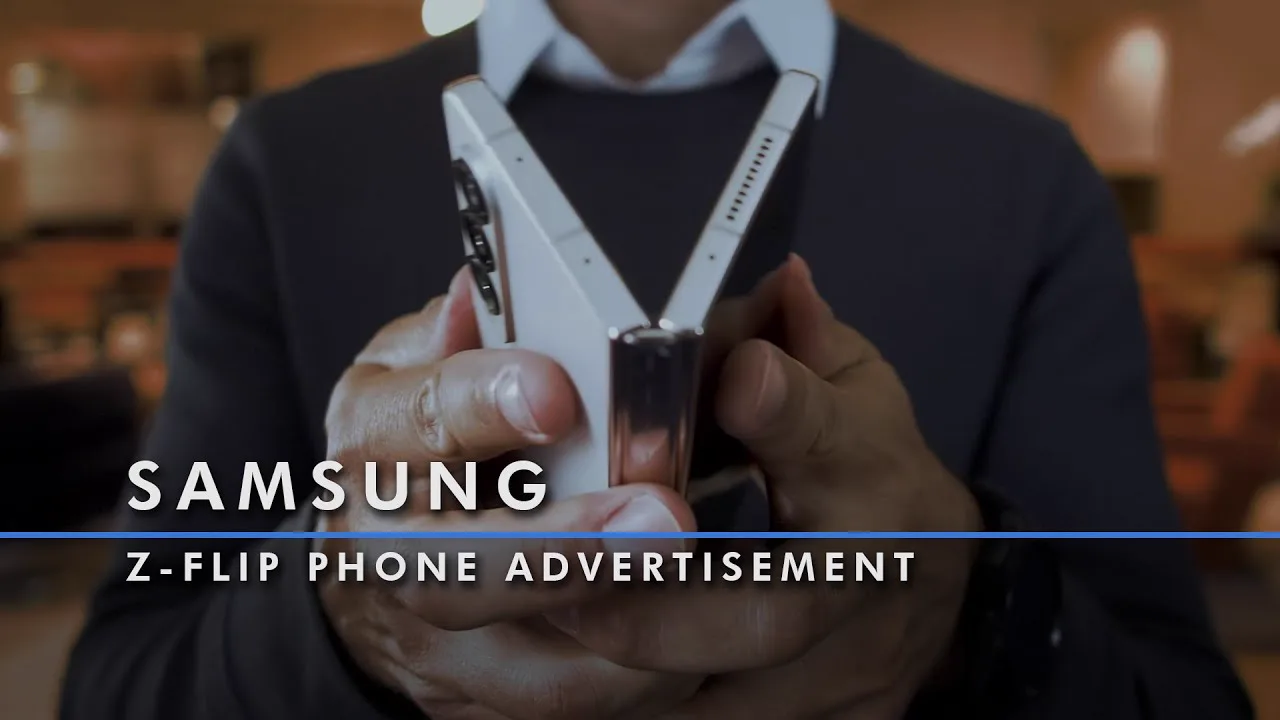Hands holding a Samsung Z-Flip phone, still from a retail promo video finished by Dustin Hill